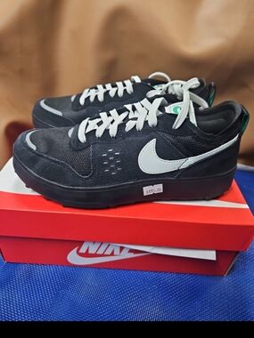 Nike Black Sneakers with White Swoosh and Laces